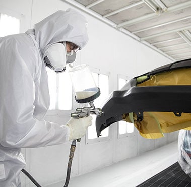 Collision Center Technician Painting a Vehicle | Coad Toyota in Cape Girardeau MO